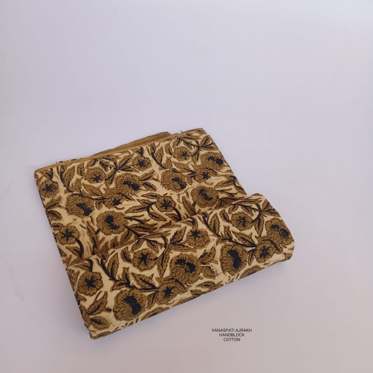 Cream floral jaal Vanaspati Bagru handblock printed pure cotton fabric, handmade with eco dyes and offered wholesale by Fabtexs.